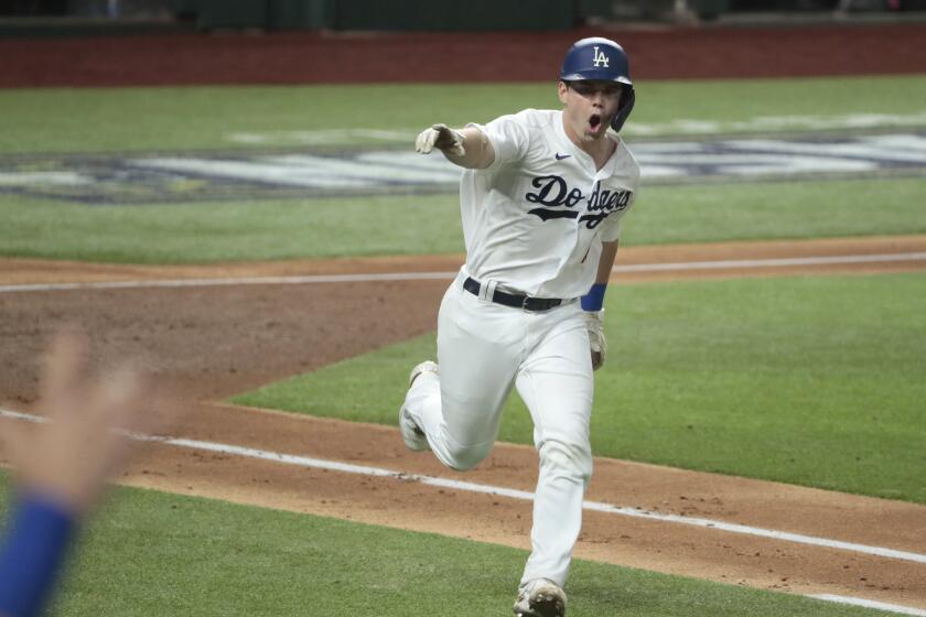 Dodgers catcher Will Smith reacts after hitting a two-run single during the third inning in Game 7 of the NLCS.
