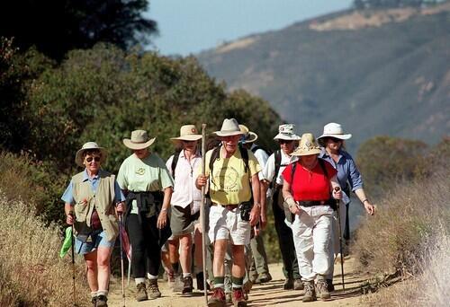 Milt McAuley, at 83, leads a group of Coastwalk hikers in 2003 along the Backbone Trail in the Santa Monica Mountains, a trail he lobbied for and used regularly.