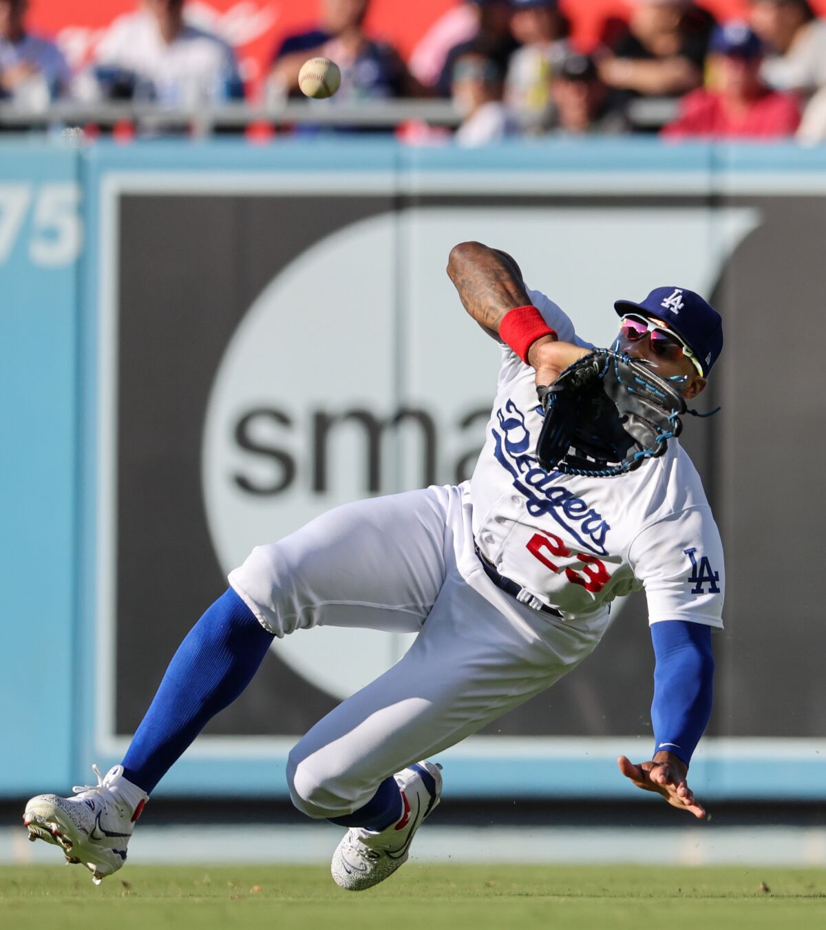 Dodgers right fielder Jason Heyward makes a sliding catch on an eighth-inning line drive by Houston's Alex Bregman.