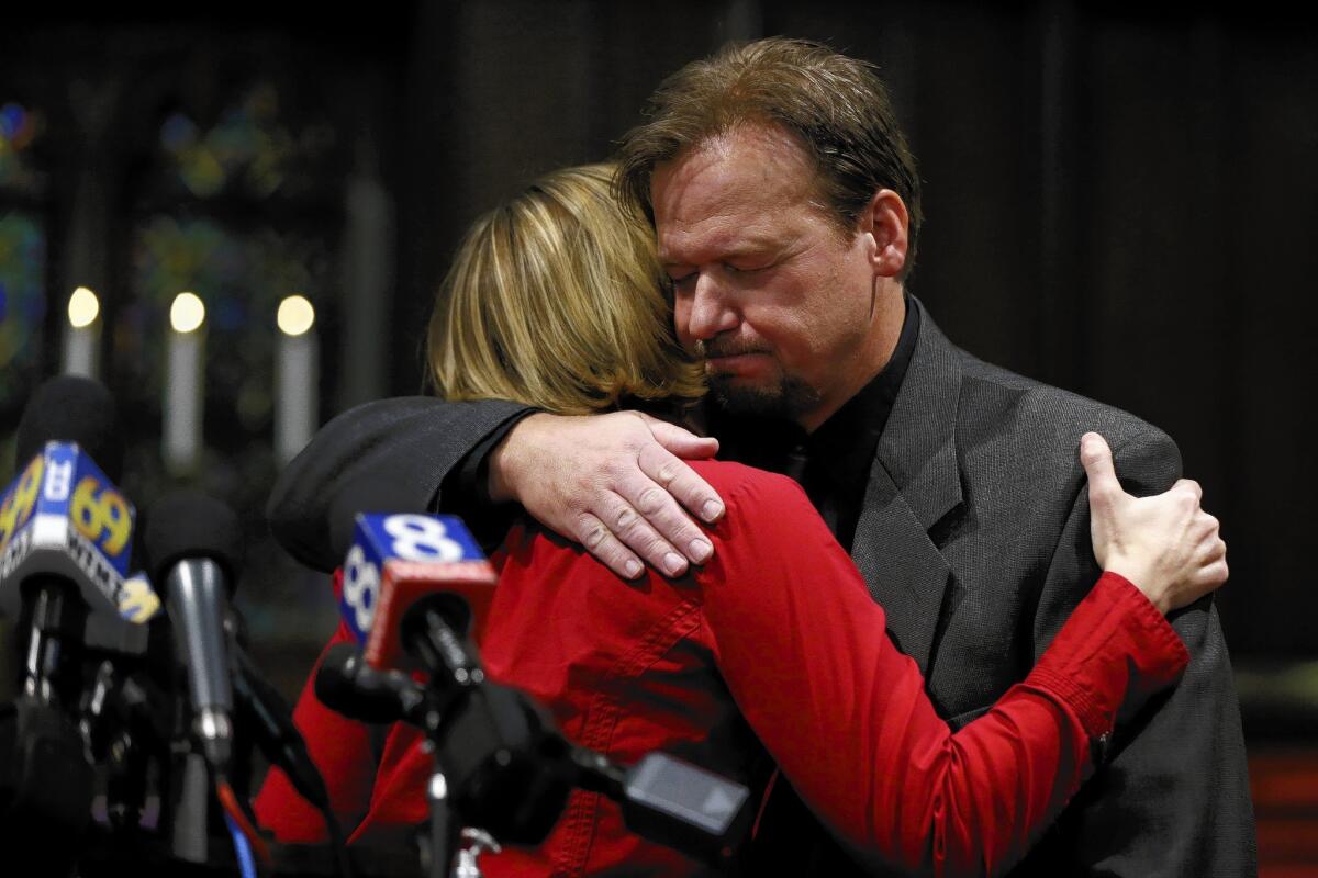 Former United Methodist pastor Frank Schaefer embraces the Rev. Lorelei Toombs during a news conference after the church announced its decision to defrock Schaefer for performing a same-sex marriage.