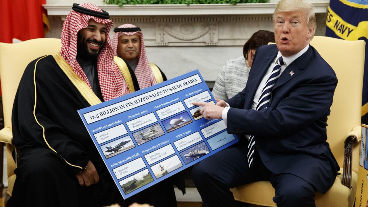 President Trump shows a chart highlighting U.S. arms sales to Saudi Arabia during a meeting with Saudi Crown Prince Mohammed bin Salman in the White House on March 20.