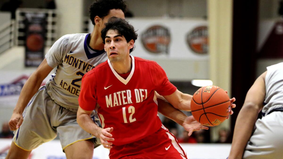 Spencer Freedman, driving the lane against Montverde Academy during the Hoophall Classic on Jan. 15, will lead Mater Dei into the Southern Section Open Division championship game against Sierra Canyon.