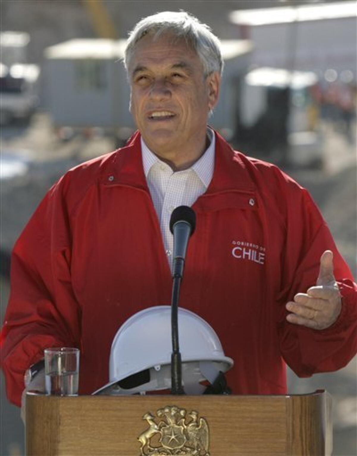 Chile's President Sebastian Pinera talks to the press at the San Jose mine near Copiapo, Chile, Tuesday, Oct. 12, 2010. The first of 33 trapped miners is expected to be lifted to the surface late Tuesday, after surviving more than two months below ground. (AP Photo/Jorge Saenz)