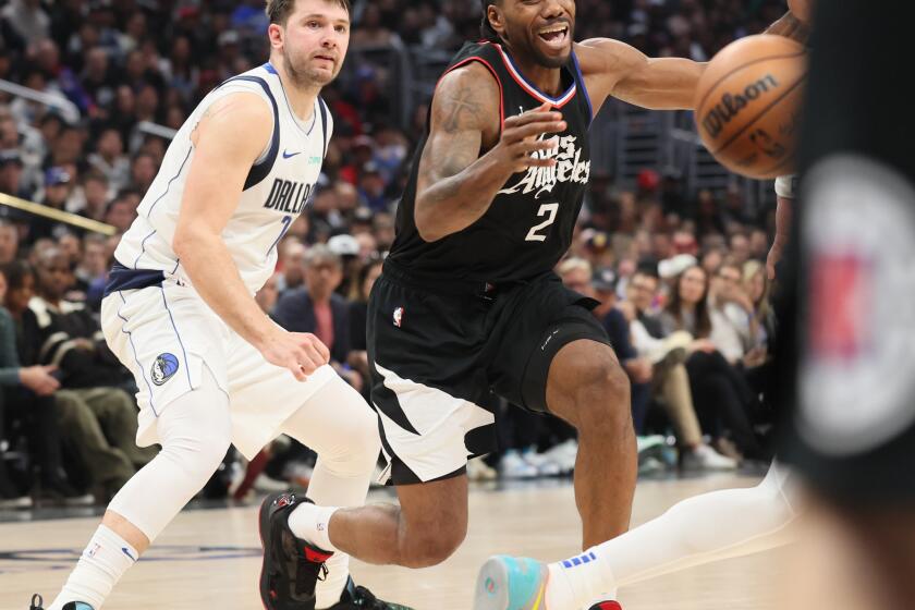 Los Angeles, CA, Tuesday, April 23, 2024 - LA Clippers forward Kawhi Leonard (2) loses control of the ball while guarded by Dallas Mavericks guard Luka Doncic (77) in game two of the NBA Western Conference playoffs at Crypto.Com Arena. (Robert Gauthier/Los Angeles Times)