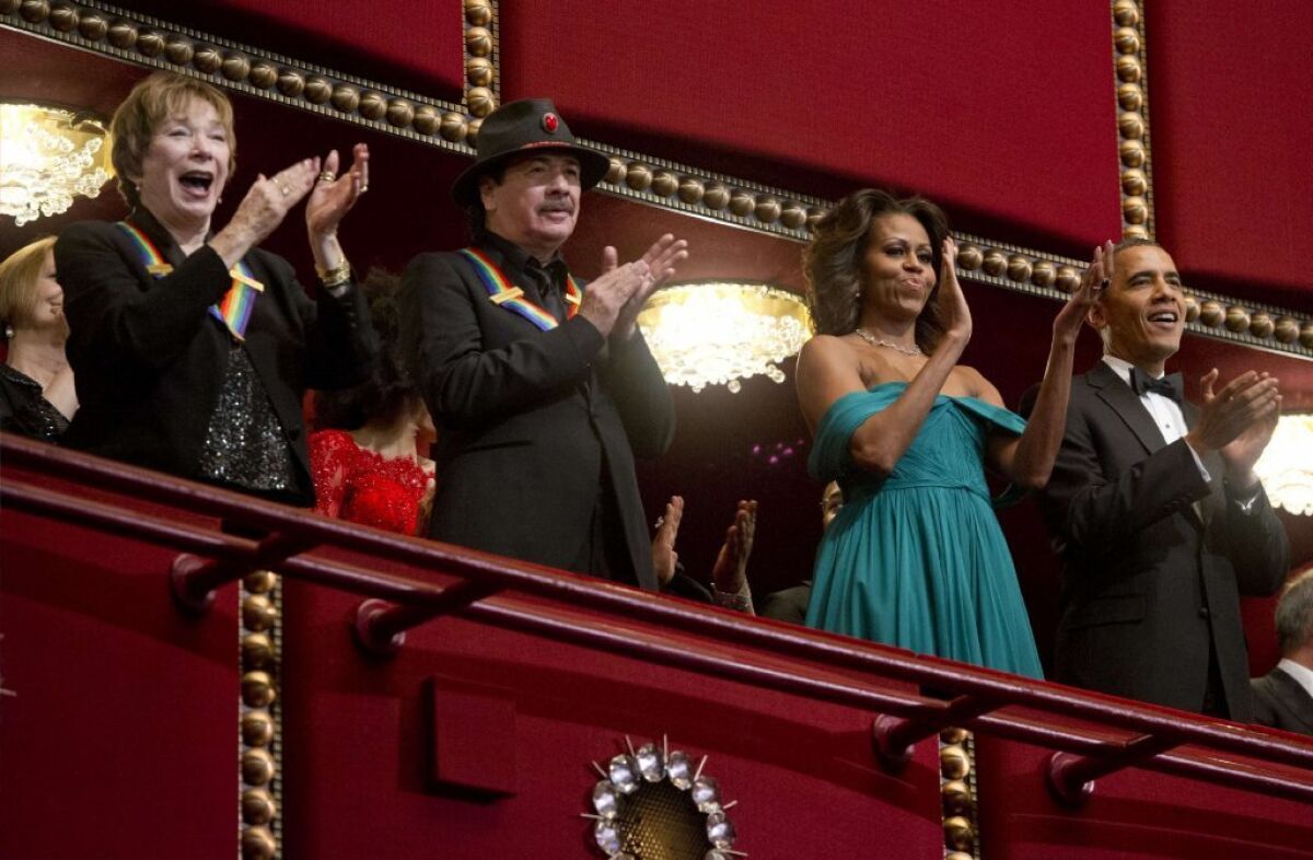 President Obama and First Lady Michelle Obama applaud during the 2013 Kennedy Center Honors ceremony in Washington, D.C., with honorees Carlos Santana and Shirley MacLaine at left. The president's new budget proposal would increase funding for D.C. museums but not for the Kennedy Center -- or three federal arts and cultural grant-making agencies.