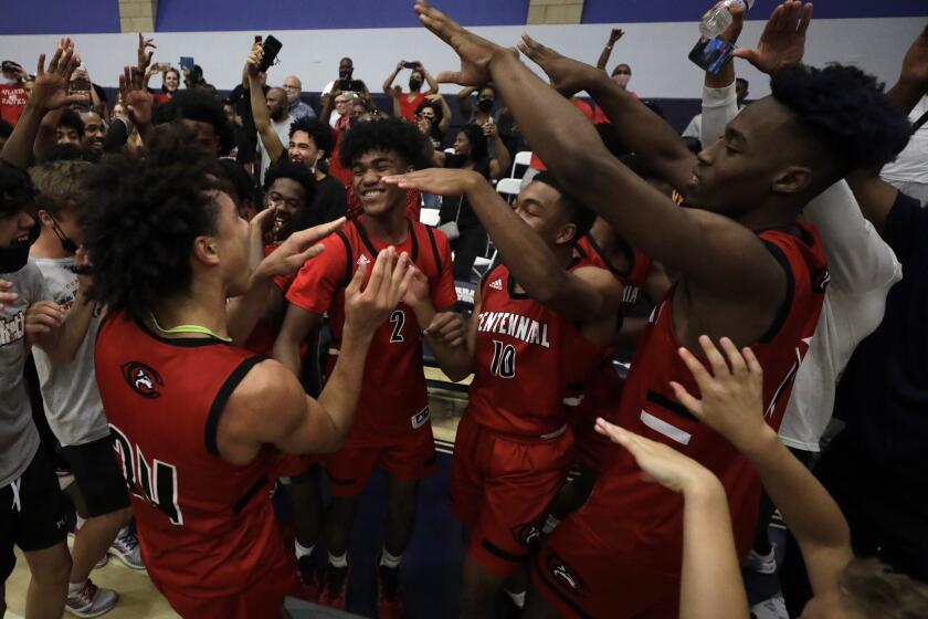 CHATSWORTH, CA - JUNE 11: Corona Centennial players celebrate their win over Sierra Canyon for the Southern Section Open Division title on Friday, June 11, 2021 in Chatsworth, CA. (Myung J. Chun / Los Angeles Times)
