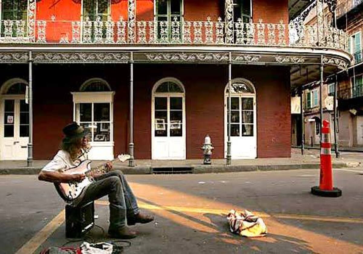 Troy Tallent brings some blues back to the French Quarter, by playing for the few residents and police still in the neighborhood. Originally from Georgia, Troy came to New Orleans in 1987 and he hasn't left yet.
