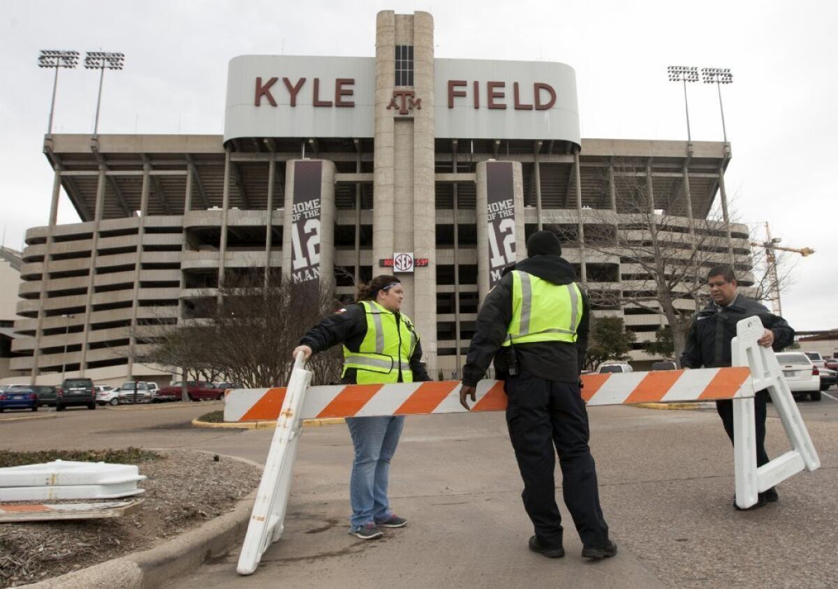 Texas A&M; security personnel barricade the entrance to Kyle Field after a bomb threat at the university in College Station, Texas.