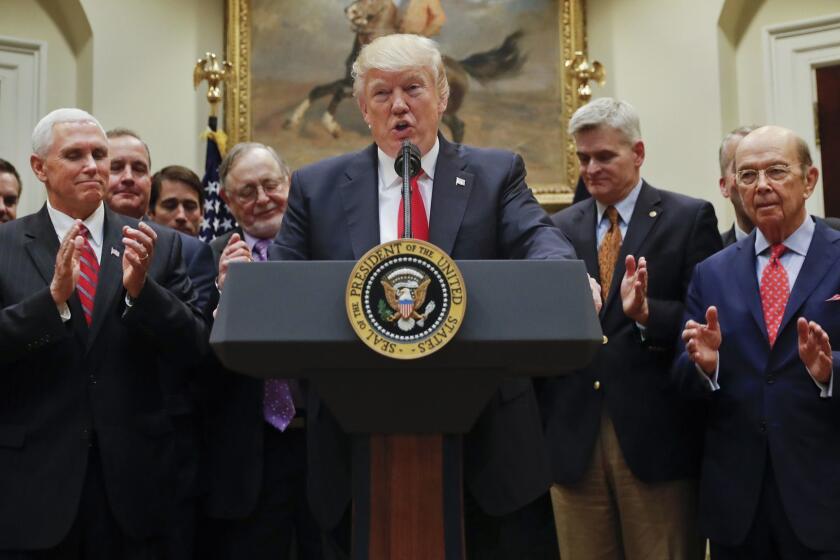 President Donald Trump speaks in the Roosevelt Room of the White House in Washington, Friday, April 28, 2017, before signing an Executive Order directing the Interior Department to begin review of restrictive drilling policies for the outer-continental shelf. From left are, Vice President Mike Pence, Rep. Don Young, R-Alaska, the president, Sen. Bill Cassidy, R-La., and Commerce Secretary Wilbur Ross. (AP Photo/Pablo Martinez Monsivais)