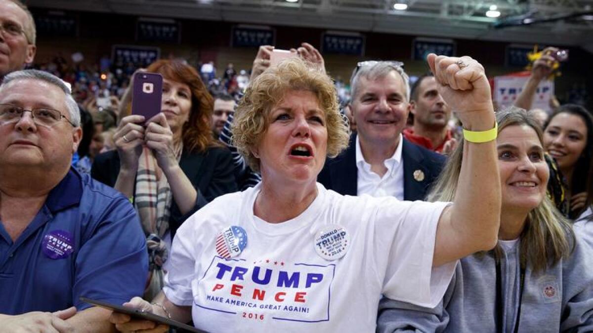 Supporters of Republican presidential candidate Donald Trump cheer at a campaign rally Oct. 10 in Ambridge, Pa.