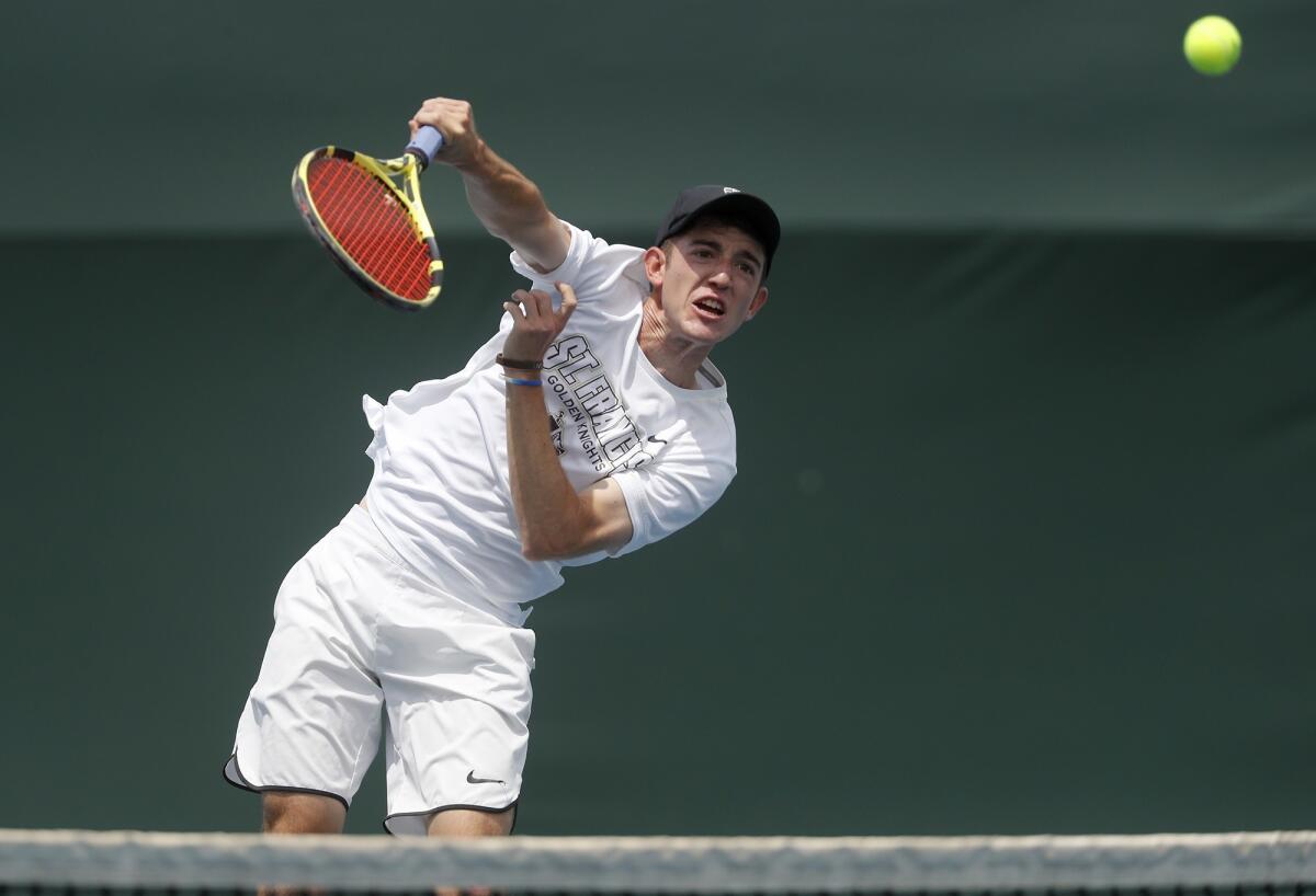 St. Francis' Ian Freer returns the ball against Corona del Mar's Kyle Pham in the singles final of the CIF Southern Section Individuals tournament on Thursday at Seal Beach Tennis Center.