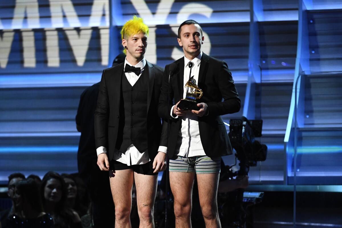 Josh Dun, left, and Tyler Joseph of Twenty One Pilots stripped down to their underwear to accept their first Grammy.
