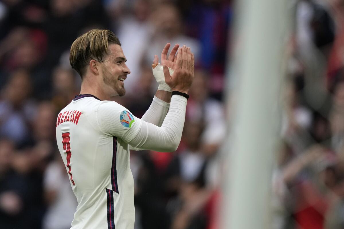 England's Jack Grealish applauds the fans at the end of the Euro 2020 soccer championship round of 16 match between England and Germany at Wembley stadium in London, Tuesday, June 29, 2021. England won 2-0. (AP Photo/Frank Augstein, Pool)