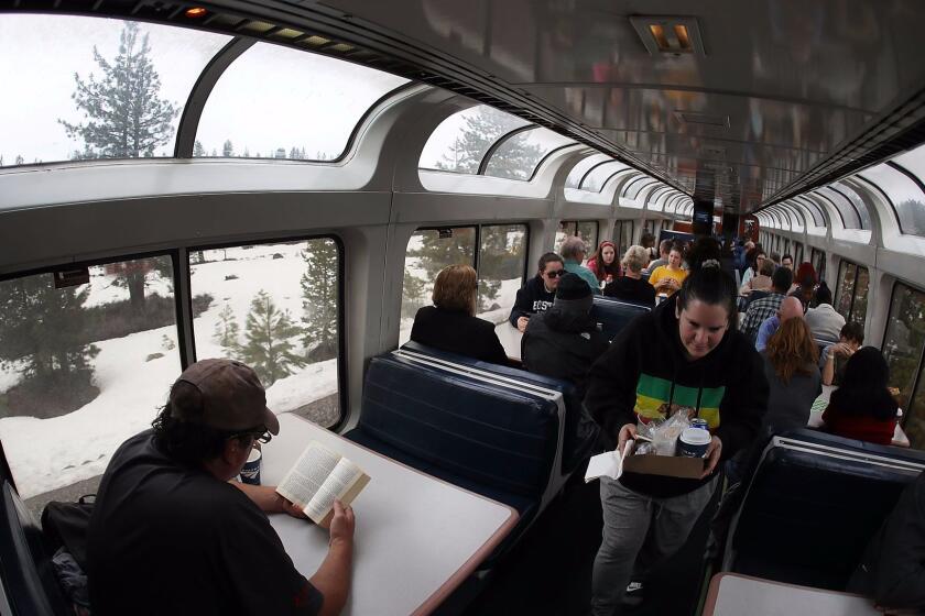 TRUCKEE, CA - MARCH 25: People enjoy the view from Amtrak's California Zephyr sightseer lounge car as it passes through the country-side on its daily 2,438-mile trip to Emeryville/San Francisco from Chicago that takes roughly 52 hours on March 25, 2017 in Truckee, United States. President Trump has proposed a national budget that would terminate federal support for Amtrak's long distance train services, which would affect the California Zephyr and other long distance rail lines run by Amtrak. (Photo by Joe Raedle/Getty Images) ** OUTS - ELSENT, FPG, CM - OUTS * NM, PH, VA if sourced by CT, LA or MoD **