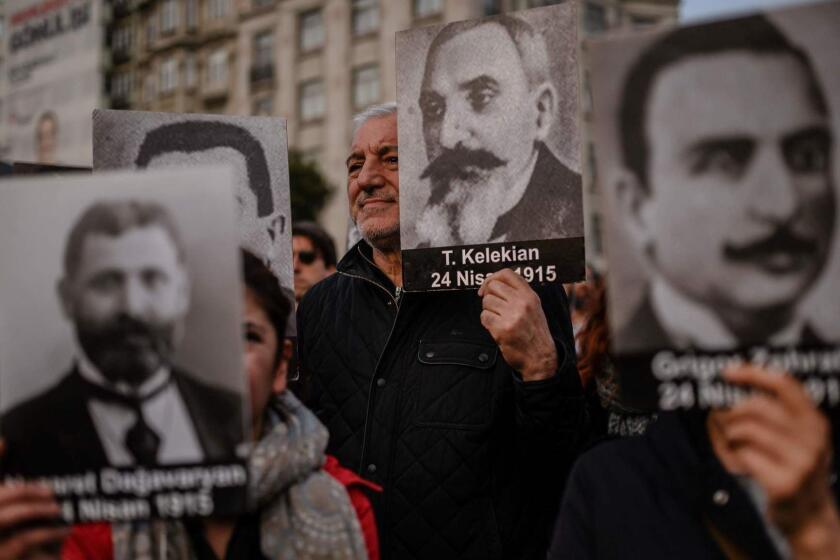People hold portraits of Armenian intellectuals -who were detained and deported in 1915- during a rally held to commemorate the 104th anniversary of the 1915 mass killing of Armenians in the Ottoman Empire near Istiklal avenue at Sishane square in Istanbul on April 24, 2019. - Armenians say up to 1.5 million people were killed during World War I as the Ottoman Empire was falling apart, a claim supported by many other countries. It has long sought international recognition of this as genocide, as agreed by around 20 countries and some parliaments. The charge is vehemently rejected by Turkey, inheritor of the dismantled empire, which admits nonetheless that up to 500,000 Armenians were killed in fighting, some massacres and from starvation. (Photo by BULENT KILIC / AFP)BULENT KILIC/AFP/Getty Images ** OUTS - ELSENT, FPG, CM - OUTS * NM, PH, VA if sourced by CT, LA or MoD **