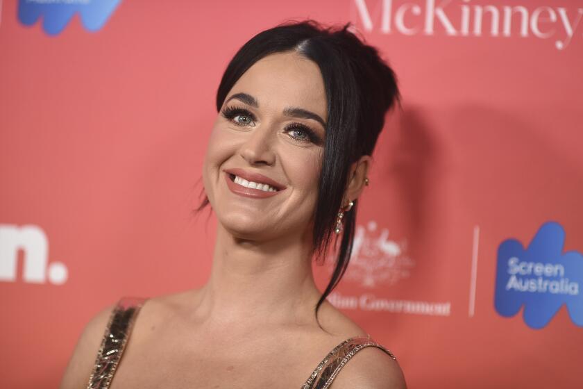 Katy Perry smiling at a red carpet event