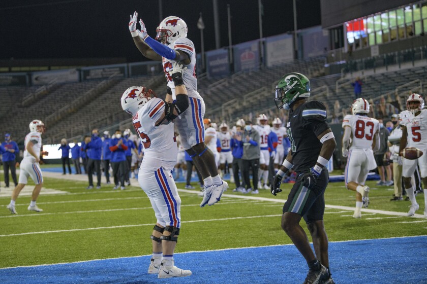 Southern Methodist running back Ulysses Bentley gets a lift from offensive lineman Hayden Howerton on Oct. 16, 2020.