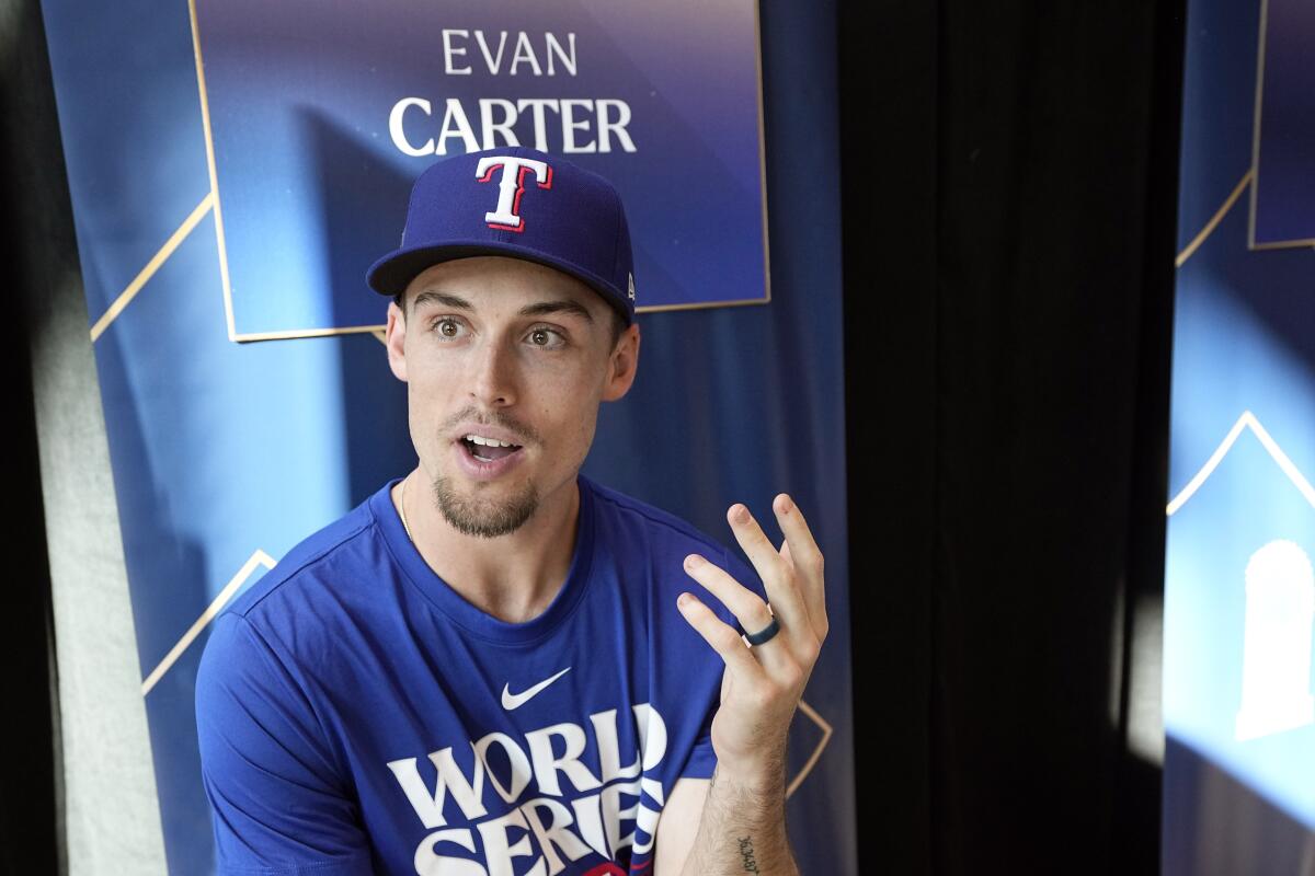 Texas Rangers outfielder Evan Carter answers a question at World Series media day on Oct. 26, 2023, in Arlington, Texas.