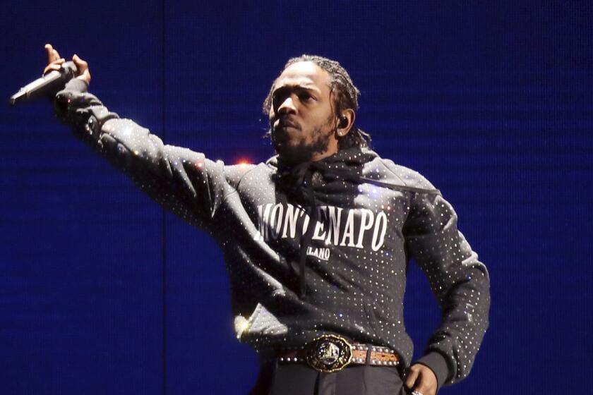 FILE - In this Feb. 21, 2018 file photo, Kendrick Lamar performs at the Brit Awards 2018 in London. Lamar, Lil Wayne and Meek Mill helped the famed Summer Jam music event celebrate its 25th anniversary with jam-packed performances. Remy Ma, Tory Lanez and BBD also worked the stage Sunday for the feverish audience at the MetLife Stadium in East Rutherford, New Jersey. (Photo by Joel C Ryan/Invision/AP, File)