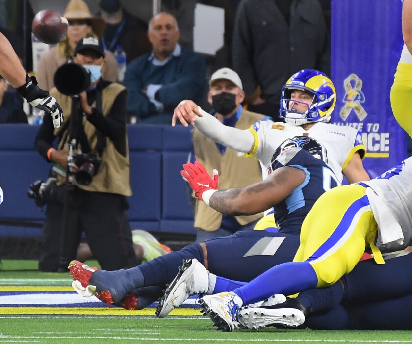 Rams quarterback Matthew Stafford throws a pass from the end zone that was intercepted and set up a Titans touchdown.