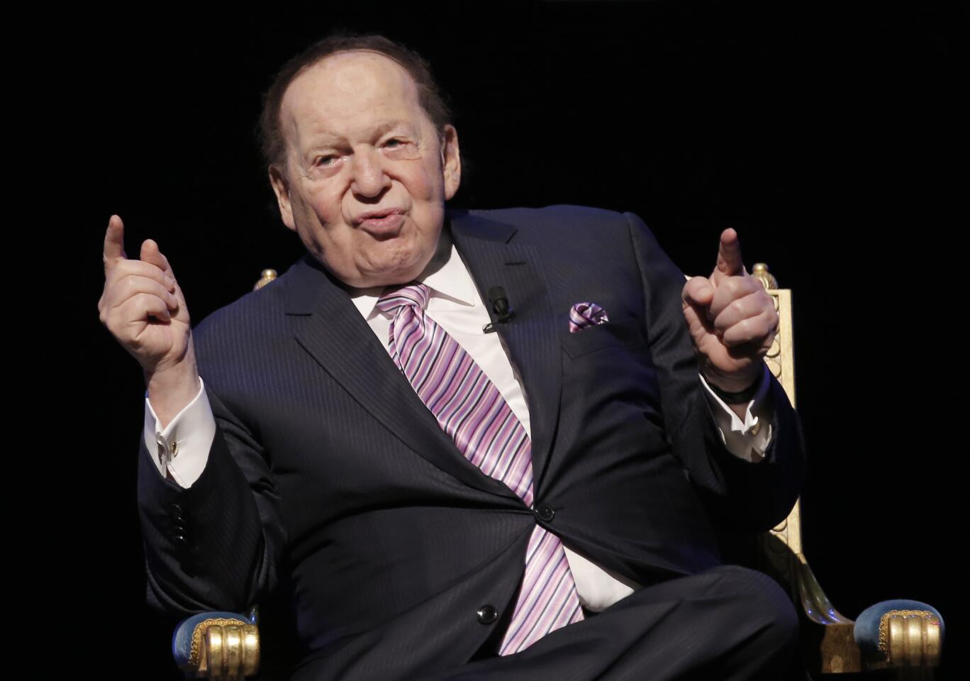 Sheldon Adelson points his fingers while speaking.