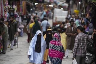 People walk at a busy market in Srinagar, Indian controlled Kashmir, Friday, Aug.16, 2024. (AP Photo/Mukhtar Khan)