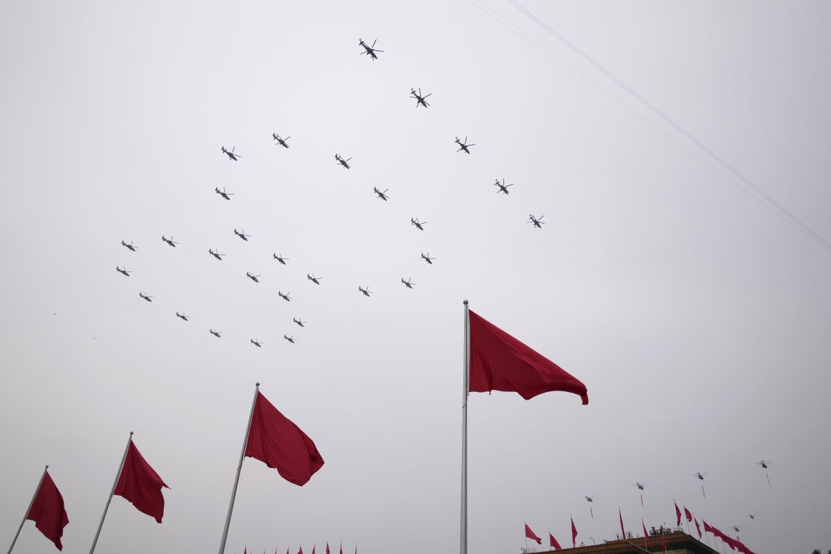 Helicopters in formation over Tiananmen Square in Beijing