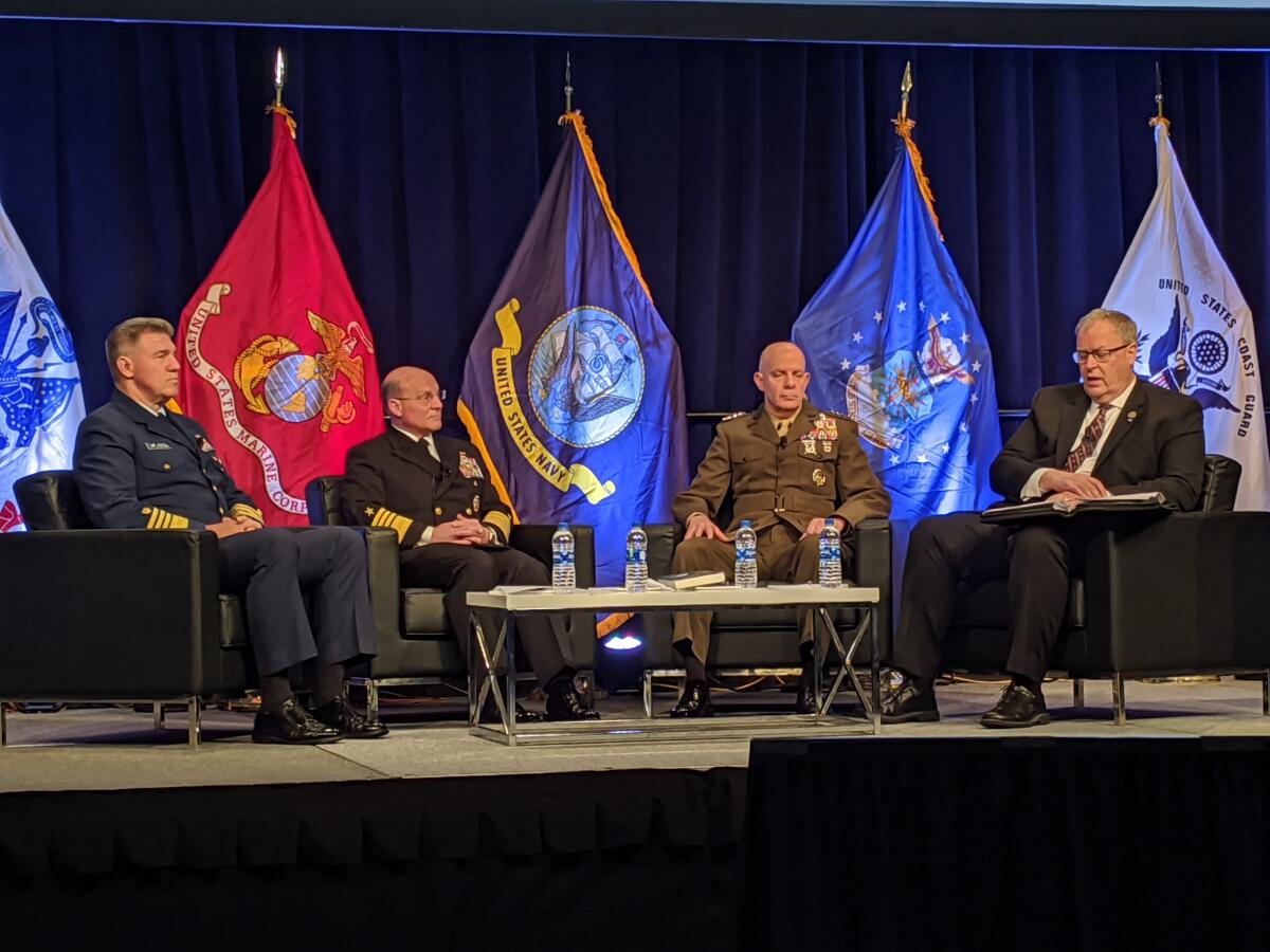 Coast Guard Adm. Karl Schultz, left, Navy Adm. Mike Gilday and Marine Corps Gen. David Berger speak with moderator Robert Work at the West 2020 conference in San Diego.