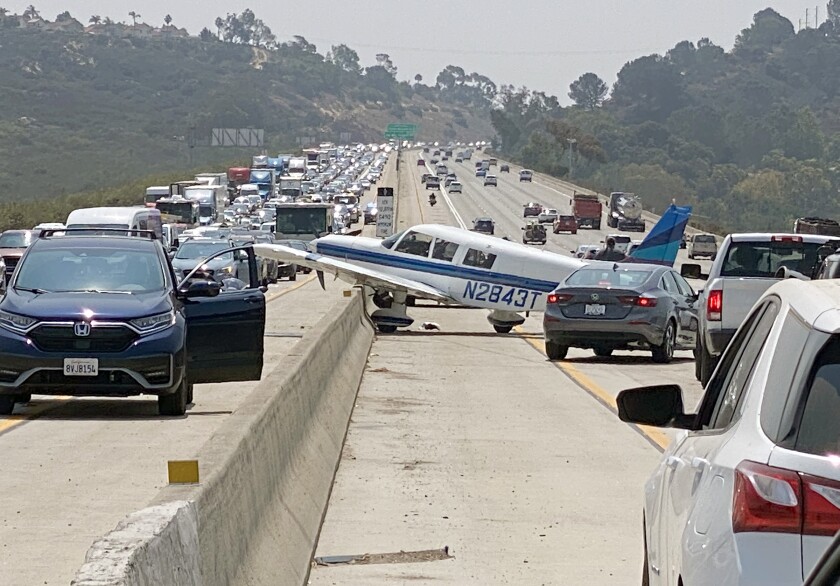 A small single engine plane made an emergency landing on the southbound I-5 freeway near Del Mar