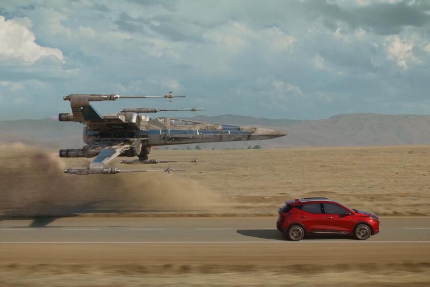 An X-wing from the "Star Wars" universe flies alongside a Bolt EUV in Chevrolet's "Magic is Electric" ad.