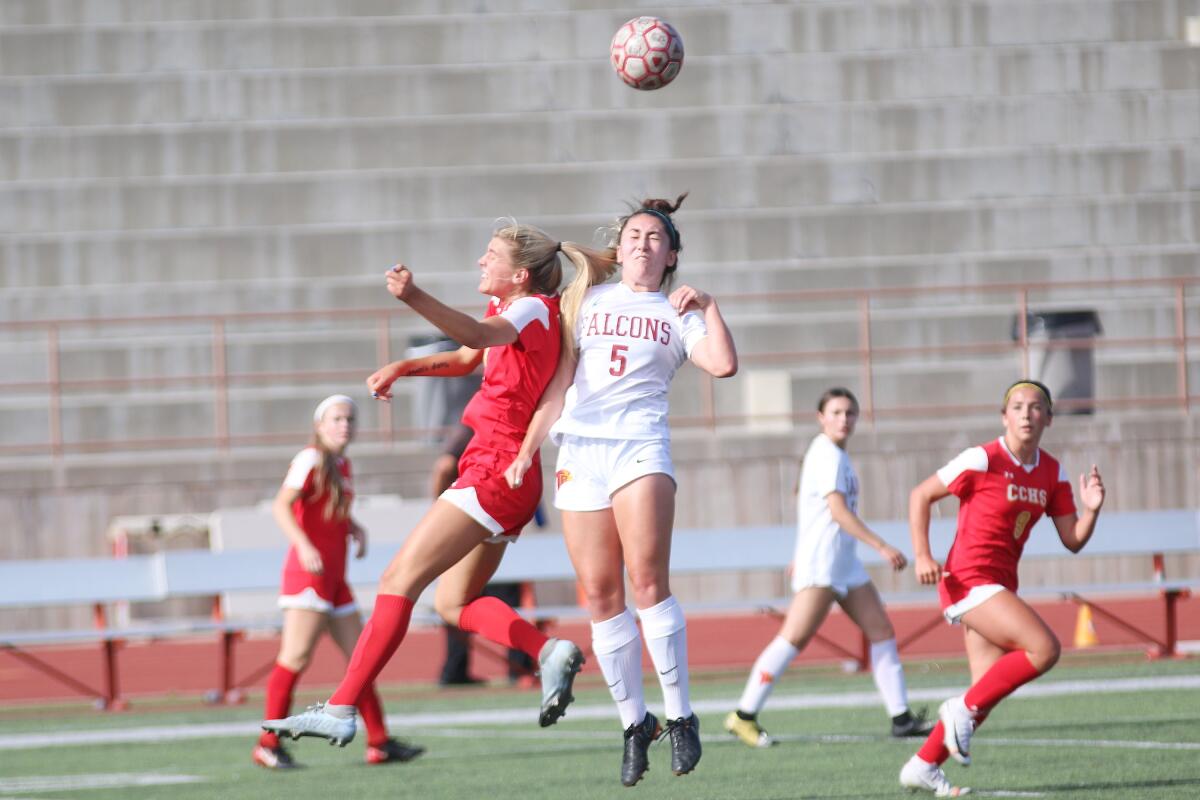 TP's Carolina Nelson and CC's Kelsey Branson battle in the midfield.