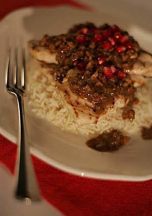 Add some color to your chicken dish with some pomegranate. Recipe: Chicken with pomegranate-walnut sauce