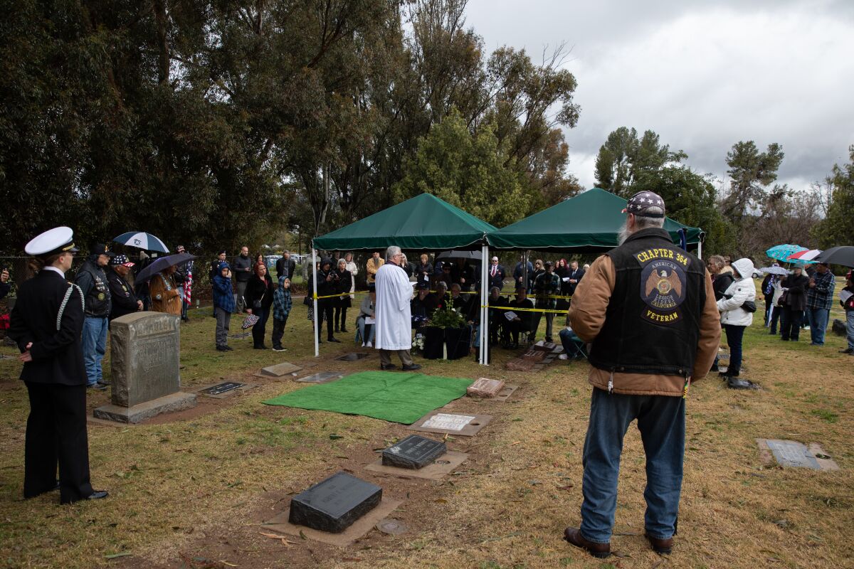 Family members and friends at a ceremony for Army Pfc. Thomas F. Green at Nuevo Memory Gardens in Ramona. 