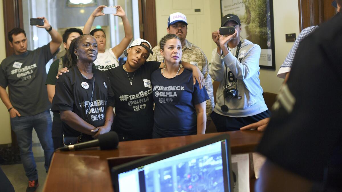 Activists affiliated with the Black Lives Matter movement deliver a petition with more than 9,000 signatures to Mayor Eric Garcetti's office, asking him to fire Police Chief Charlie Beck.