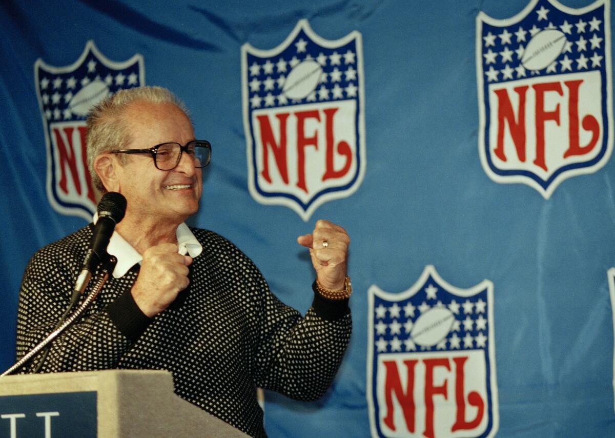 In this Oct. 27, 1993, file photo, San Diego Chargers owner Alex Spanos gestues after the NFL announced that San Diego secured the 1990 Super Bowl. Alex Spanos, who used his fortune from construction and real estate to buy the Chargers in 1984, died Tuesday, Oct. 9, 2018. He was 95.