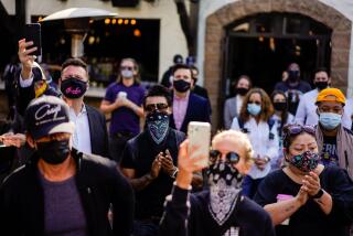 WEST HOLLYWOOD, CA - NOVEMBER 25: Supporters and business owners of area restaurants and businesses listen to a press conference held by the California Coalition for Safe Reopening at The Abbey on Wednesday, Nov. 25, 2020 in West Hollywood, CA. L.A. County restaurant owners fear they won't survive another COVID-19 shutdown. (Kent Nishimura / Los Angeles Times)