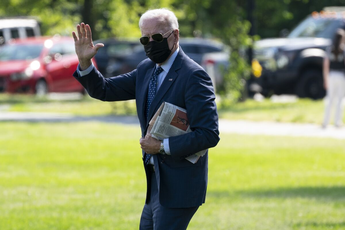 President Joe Biden walks to board Marine One on the Ellipse near the White House for a trip to Delaware, Wednesday, June 2, 2021, in Washington. (AP Photo/Evan Vucci)