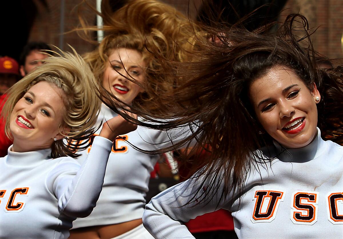 The USC song girls stir up school spirit during a rally in the heart of campus on Wednesday, Oct. 9, 2013
