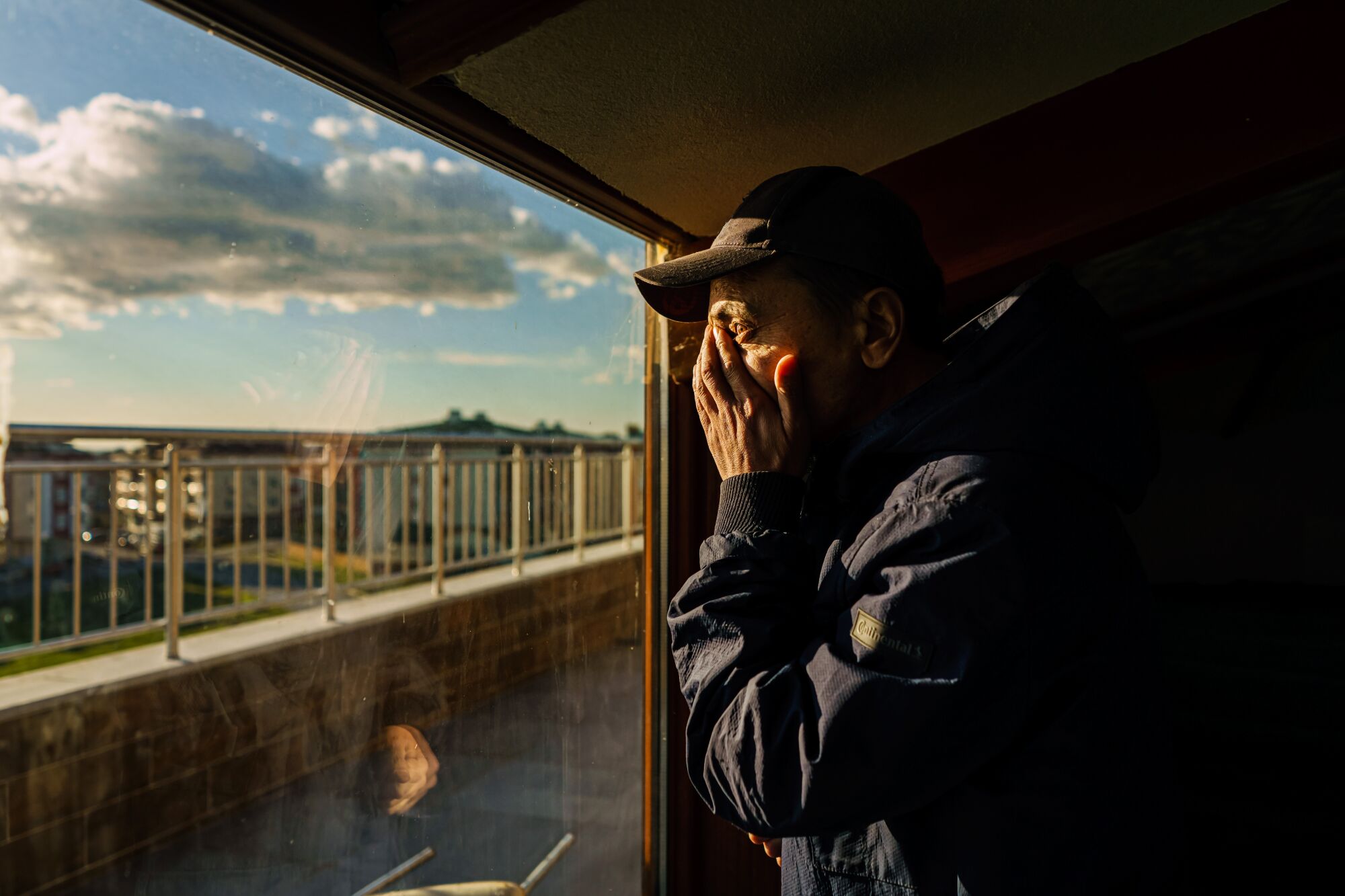 Aqil Abdullah, 37, looks toward the sea from the prayer room at a school and orphanage for Uyghur children 
