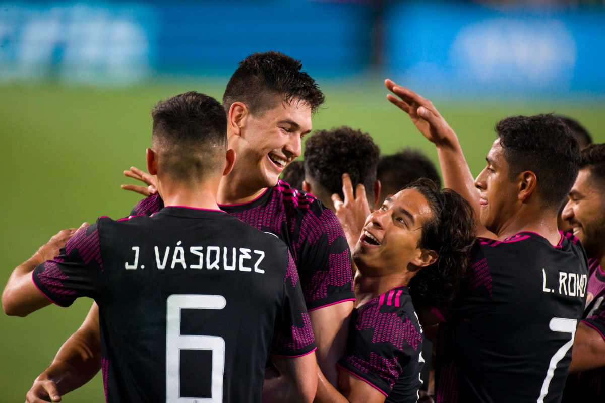 Mexico’s Cesar Montes Castro celebrates with teammate Diego Lainez.