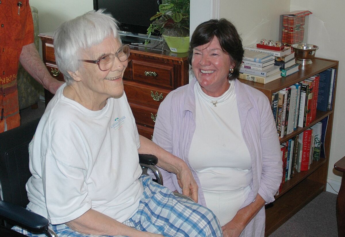 Harper Lee, left, seen in 2010 at her assisted living facility in Monroeville, Ala., with actress Mary Badham, who played Scout in the 1962 film adaptation of "To Kill a Mockingbird."