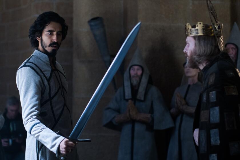 Dev Patel and Sean Harris in the movie "The Green Knight."