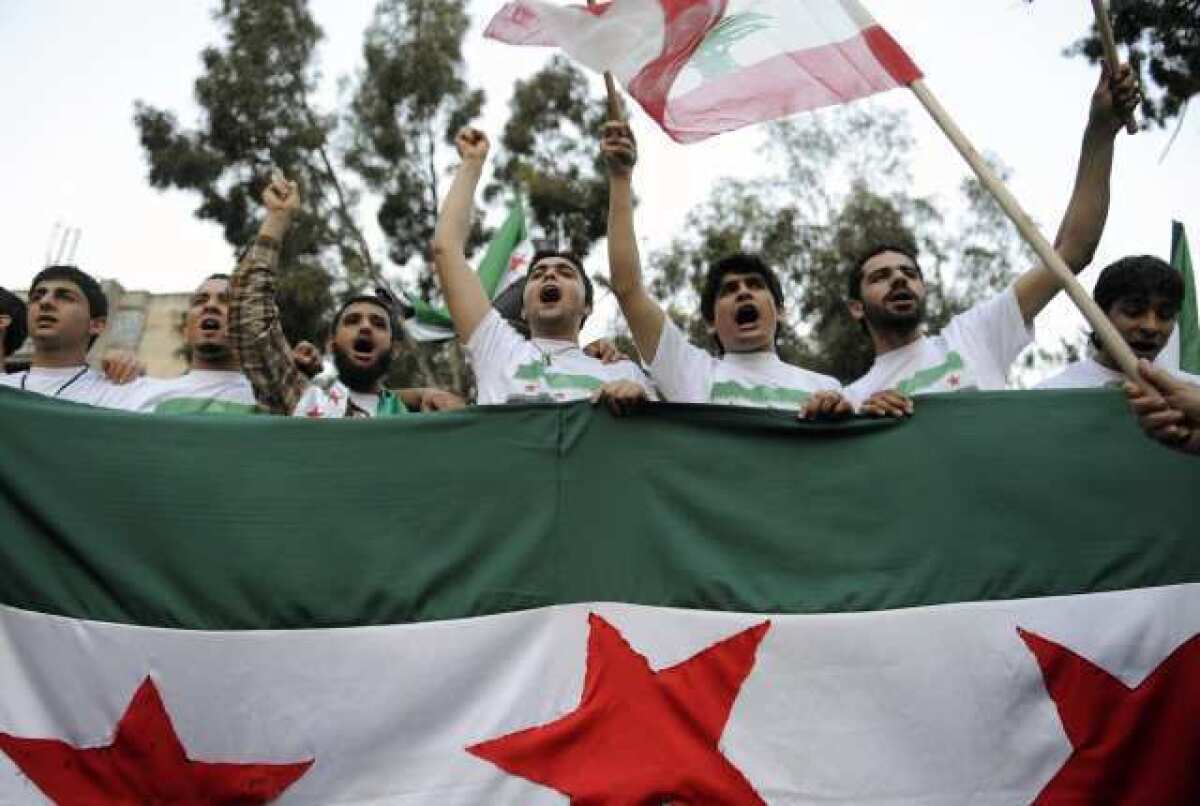 Syrians living in Lebanon shout slogans against Syrian President Bashar Assad during a rally in Beirut on April 28.