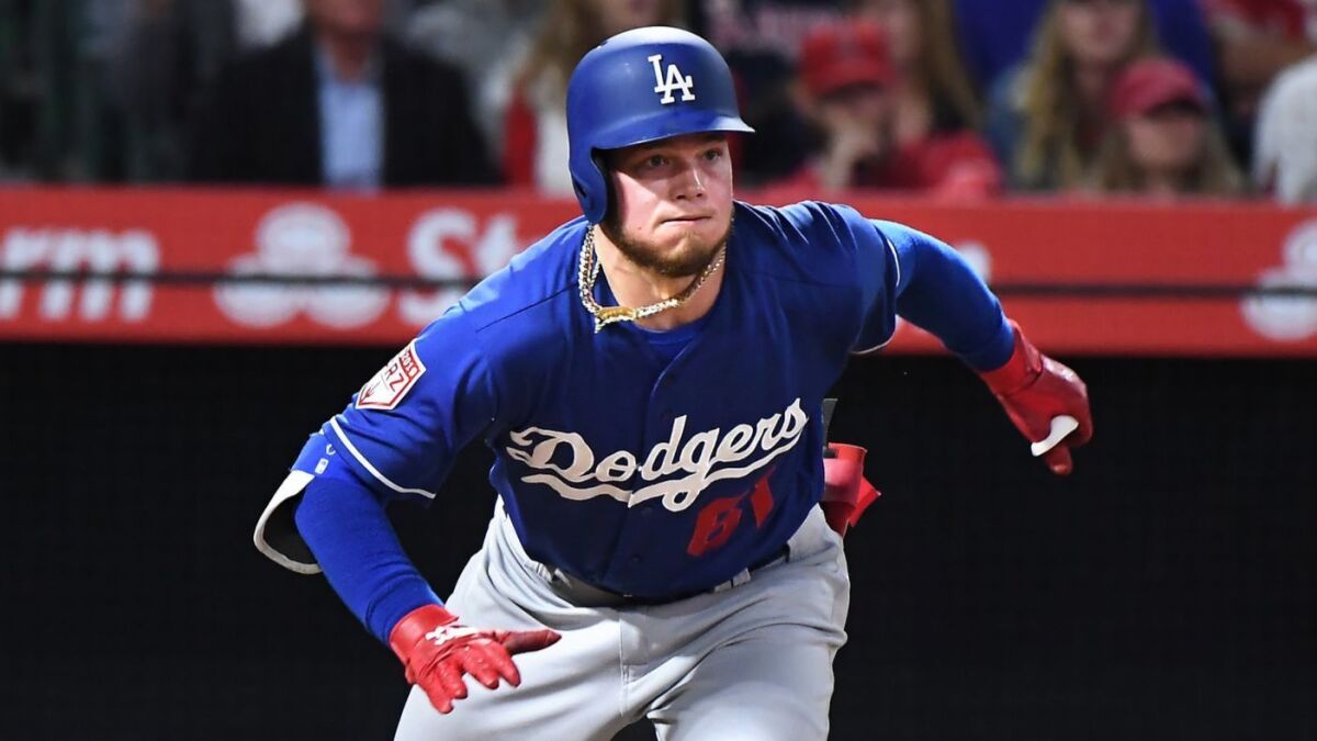 ANAHEIM, CALIFORNIA MARCH 25, 2019-Dodgers Alex Verdugo hits a double against the Angels at Anaheim Stadium Monday. (Wally Skalij/Los Angeles Times)