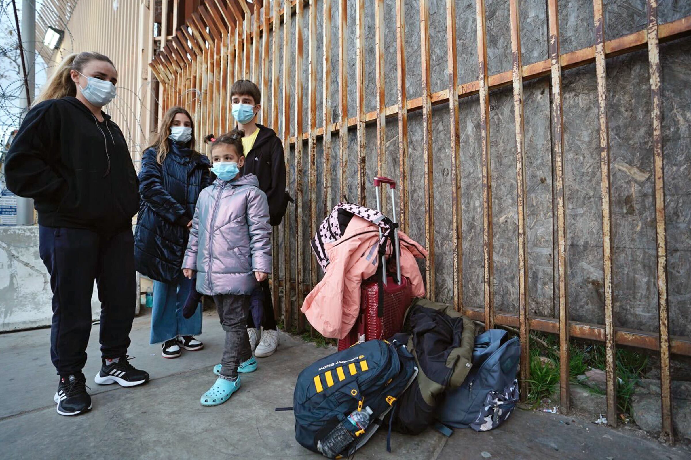 A Ukrainian family waits to enter the United States on Wednesday, March 8. 2022.