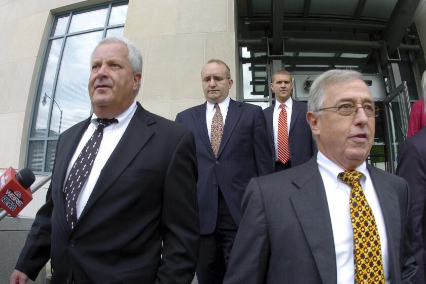 FILE - In this Tuesday, Sept., 15, 2009, file photo, former Luzerne County Court Judges Michael Conahan, front left, and Mark Ciavarella, front right, leave the United States District Courthouse in Scranton, Pa. The two Pennsylvania judges who orchestrated a scheme to send children to for-profit jails in exchange for kickbacks were ordered to pay more than $200 million to hundreds of children who fell victim to their crimes. U.S. District Judge Judge Christopher Conner awarded $106 million in compensatory damages and $100 million in punitive damages to nearly 300 plaintiffs in a long-running civil suit against the judges.(Mark Moran/The Citizens' Voice via AP)