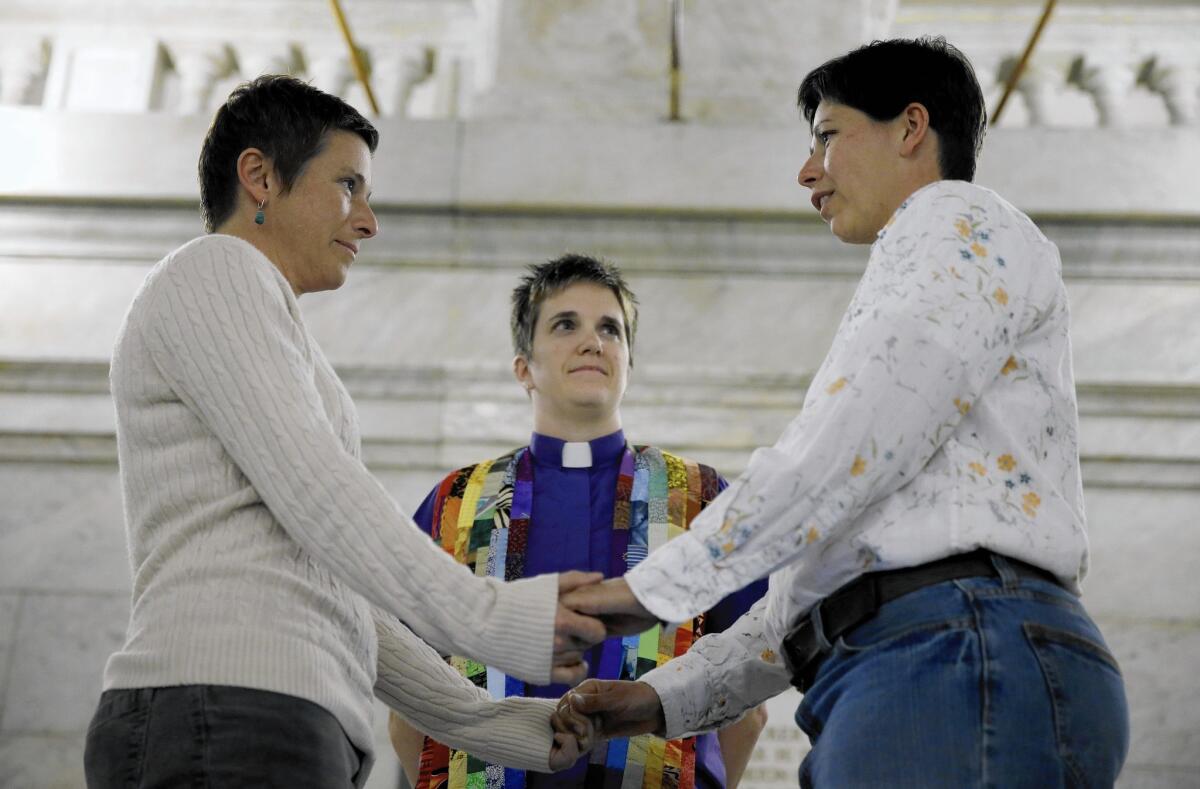 A couple marries in November in St. Louis. Some Missouri counties are issuing same-sex marriage licenses while the state's ban is being challenged.