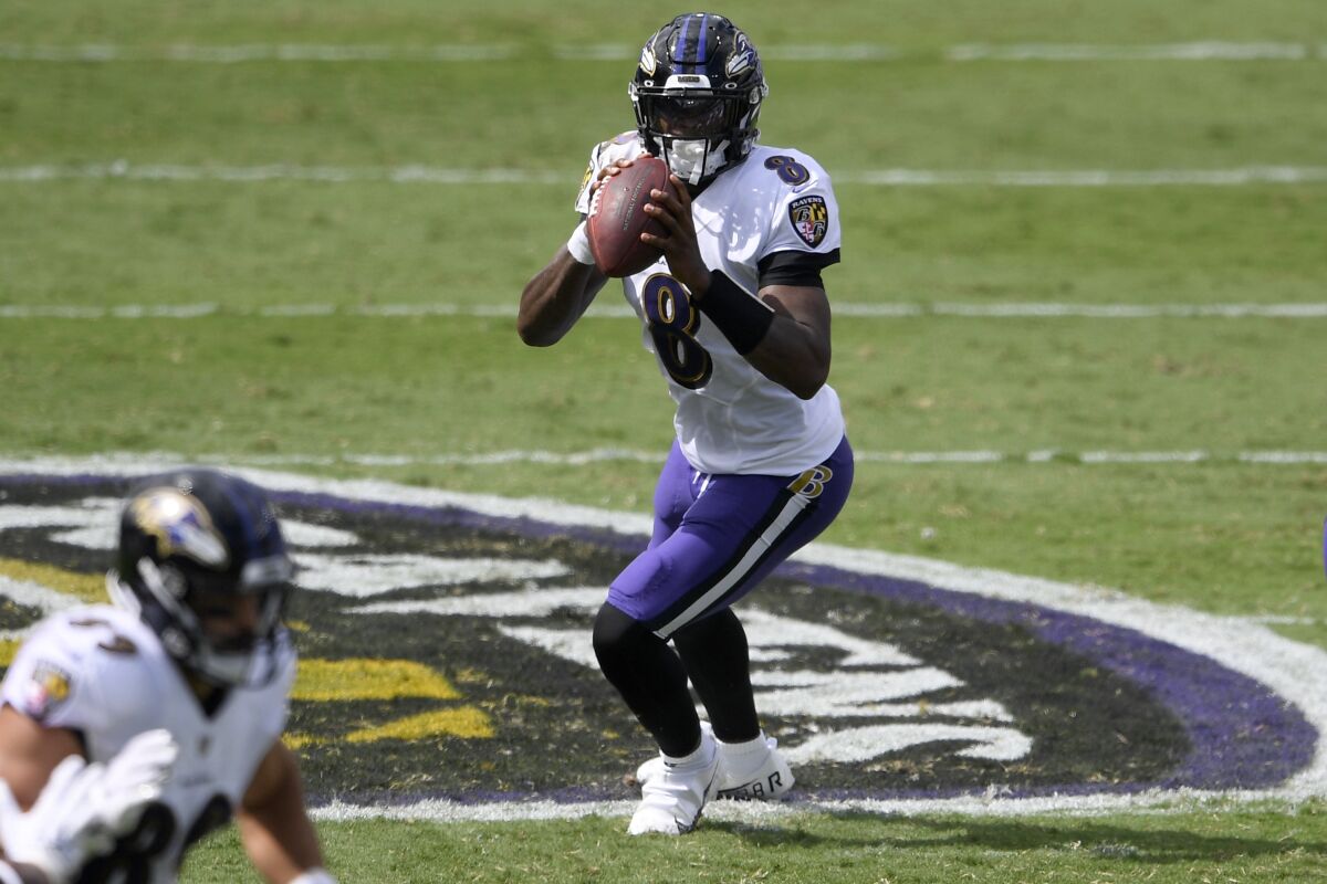 Baltimore Ravens quarterback Lamar Jackson sets to throw.