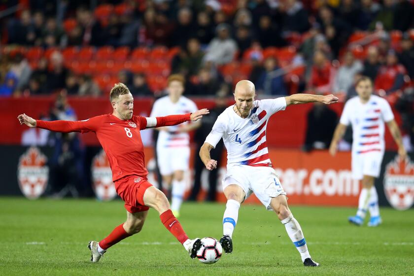 TORONTO, ON - OCTOBER 15: Michael Bradley #4 of the United States battles for the ball with Scott Arfield #8 of Canada during a CONCACAF Nations League game at BMO Field on October 15, 2019 in Toronto, Canada. (Photo by Vaughn Ridley/Getty Images)