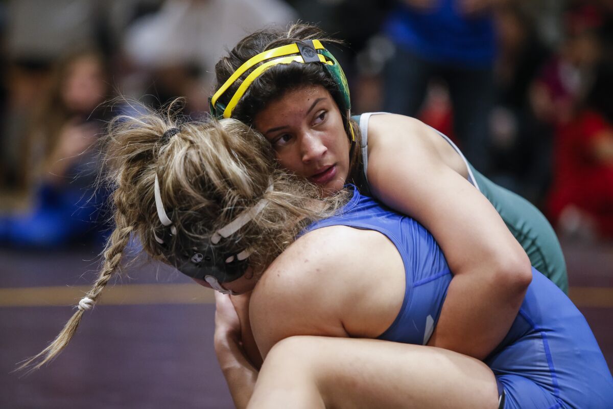 Hilltop’s Nadia Barrientos (right) takes control in defeating Madison's Amber Plasencia at last week's San Diego Section Division II championships.